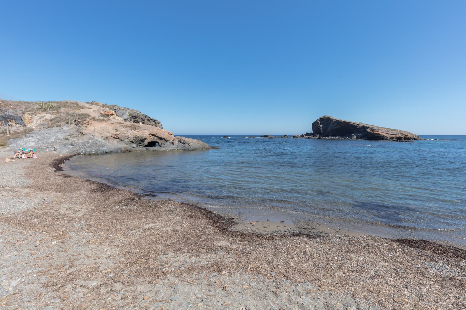Cala Flores, a rocky cove with clear water in Cabo de Palos