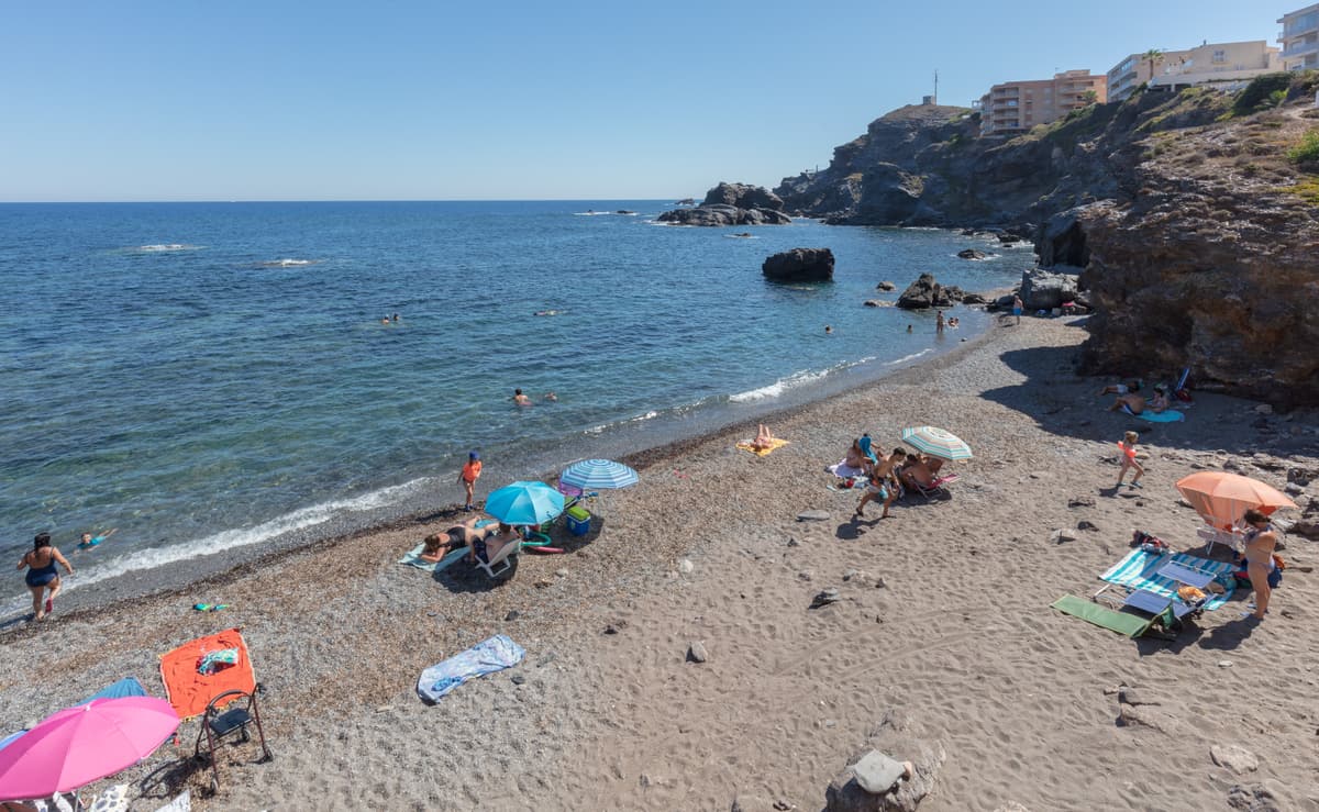 Bathers at Cala Flores, a small cove in Cabo de Palos